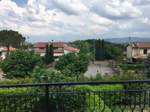 a view of a town from a balcony at Cris&Giuli House in Tavarnelle Val di Pesa +26 photos