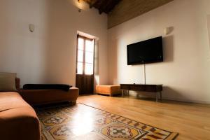 Televízia a/alebo spoločenská miestnosť v ubytovaní Casa Olivera