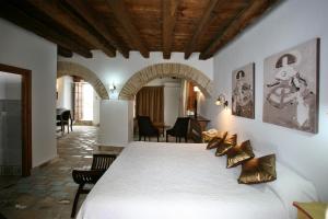 Tempat tidur dalam kamar di Posada de Palacio