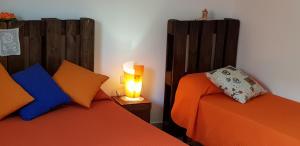 Postel nebo postele na pokoji v ubytování B&B CARRUBBELLE