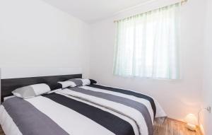 Postel nebo postele na pokoji v ubytování Kira House + 9 fotografií