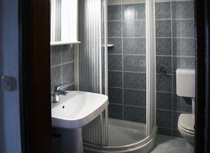 a bathroom with a sink and a shower and a toilet at Punta Rata room in Brela +34 photos
