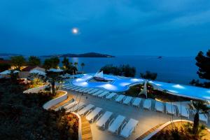 an image of a pool at a resort at night at Amadria Park Camping Trogir - Mobile Homes in Seget Vranjica
