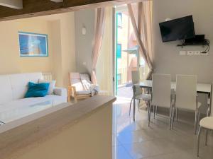 a living room with a white couch and a table at ABCdecor Italia in Imperia