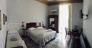 Кровать или кровати в номере Borgo Civico 10