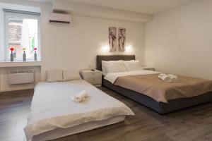 Posteľ alebo postele v izbe v ubytovaní King's Street Apartments