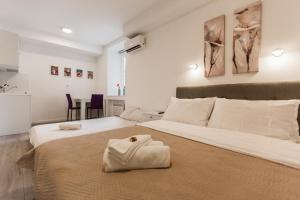 Posteľ alebo postele v izbe v ubytovaní King's Street Apartments