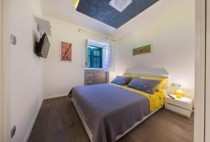 a bedroom with a large bed and a window at Centrino Apartment in Split