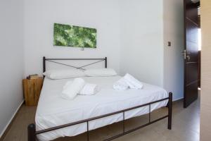 מיטה או מיטות בחדר ב-Paros Central house
