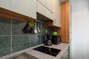 a kitchen with a sink and a microwave at "NM" Luxury apartments in Split