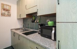 a kitchen with a sink and a microwave at "NM" Luxury apartments in Split