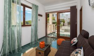 a living room with a couch and a large window at "NM" Luxury apartments in Split