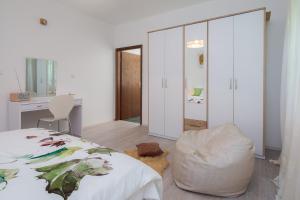 a bedroom with a bed and a chair and a desk at "NM" Luxury apartments in Split