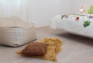 a bedroom with a bed and a pillow on the floor at "NM" Luxury apartments in Split