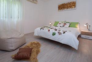 a bedroom with a bed with a teddy bear on it at "NM" Luxury apartments in Split