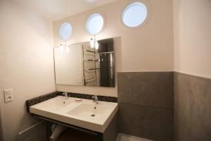 a bathroom with a sink and a mirror at Arcachon Balsamo plage in Arcachon +64 photos