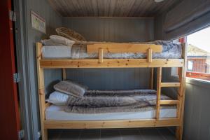 a couple of bunk beds in a room at Alten Lodge in Alta