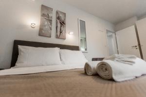 Posteľ alebo postele v izbe v ubytovaní King's Street Apartments