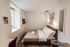 Posteľ alebo postele v izbe v ubytovaní King's Street Apartments