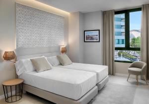 Posteľ alebo postele v izbe v ubytovaní Opera House Valencia B&B