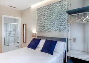 Posteľ alebo postele v izbe v ubytovaní Opera House Valencia B&B
