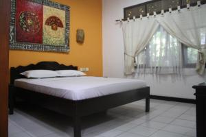 Postel nebo postele na pokoji v ubytování De Puspa Residence Seminyak
