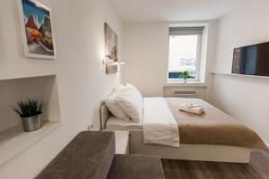 Posteľ alebo postele v izbe v ubytovaní King's Street Apartments