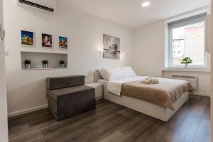 Posteľ alebo postele v izbe v ubytovaní King's Street Apartments