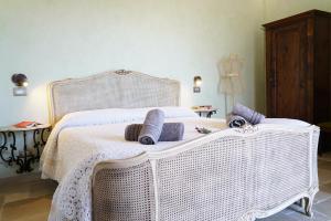 Postel nebo postele na pokoji v ubytování Masseria Le Terrazze di Serranova