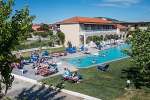 a large pool with people sitting on it at Zante Plaza Hotel & Apartments in Laganas