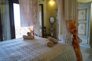 Postel nebo postele na pokoji v ubytování Masseria Le Terrazze di Serranova
