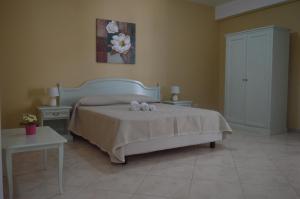 מיטה או מיטות בחדר ב-Vista D'amare