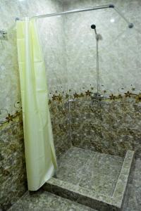 a shower with a glass door in a bathroom at ART-Rabat in Akhaltsikhe