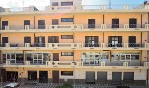 an external view of a building with balconies at Hotel Tito Serrano' in Melito di Porto Salvo
