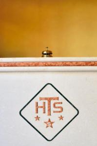 a sign on a shelf with ahs on it at Hotel Tito Serrano' in Melito di Porto Salvo