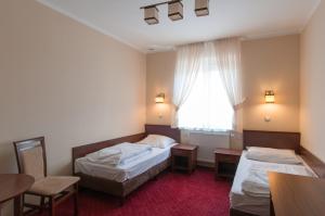 Llit o llits en una habitació de Hotel Grant
