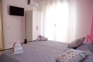Posteľ alebo postele v izbe v ubytovaní B&B Il Melograno Antico con Terrazza e Giardino