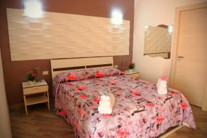 Posteľ alebo postele v izbe v ubytovaní B&B Il Melograno Antico con Terrazza e Giardino