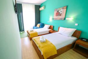 Posteľ alebo postele v izbe v ubytovaní Hotel Pine
