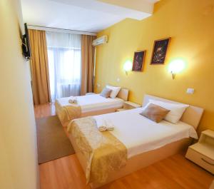 Posteľ alebo postele v izbe v ubytovaní Hotel Pine