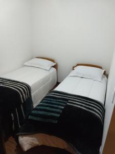 Postel nebo postele na pokoji v ubytování Cobertura Bavaria