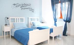 Ένα ή περισσότερα κρεβάτια σε δωμάτιο στο MarArte B&B