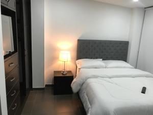 Una cama o camas en una habitación de Hotel OrangeTrip