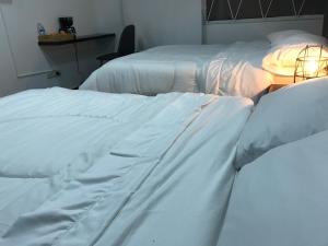 Una cama o camas en una habitación de Hotel OrangeTrip