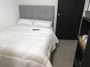 Una cama o camas en una habitación de Hotel OrangeTrip