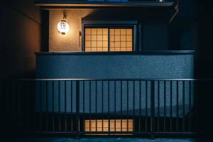 a building with a staircase and a window with lights at Miro Sanjo Saiin Tei in Kyoto