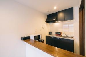 Η κουζίνα ή μικρή κουζίνα στο Miro Kujo Kawaramachi Tei