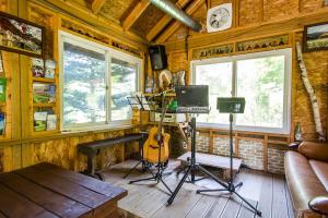 a room with a recording studio with a guitar at Sunny House in Pyeongchang