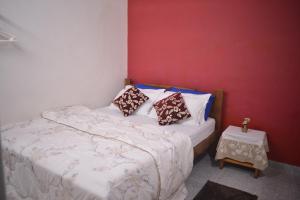Krevet ili kreveti u jedinici u objektu Agasthya Homestay - With Kitchenette