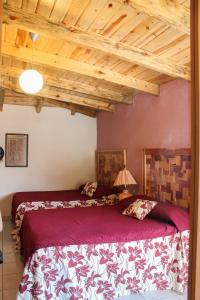 Postel nebo postele na pokoji v ubytování Villas La Quinta